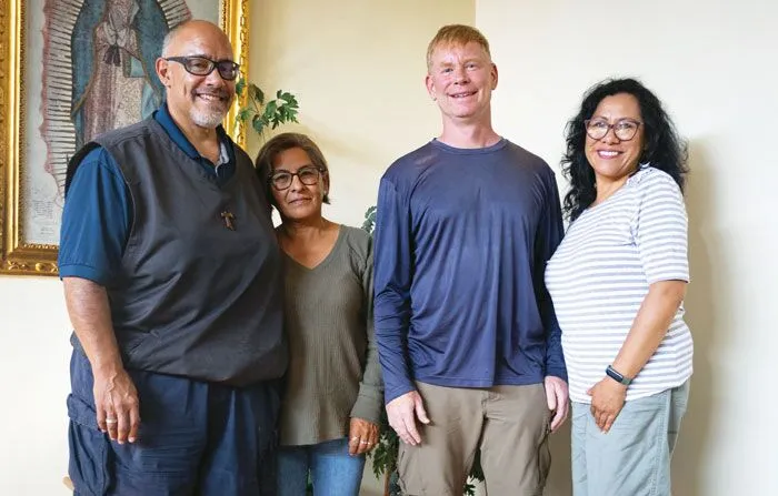 Victor Artaiz, Rosse Mary Miranda, Father McPhee and Mabel Ramírez (left to right) hold a meeting at the Maryknoll center and residence in Cochabamba.