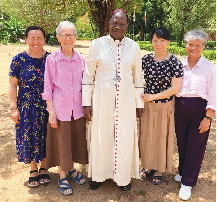 (From left to right) Sisters Norma Pocasangre, Claudette LaVerdiere, NgocHà Pham and the late Lourdes Fernandez pose with Bishop Joachim Kouraleyo of the Diocese of Moundou. 