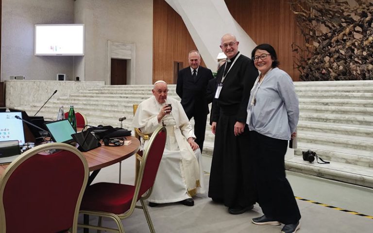 Father LaRousse is pictured with Pope Francis and others at the first session of the Synod on Synodality in October of 2023. 