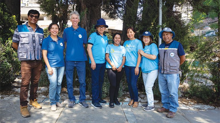 Maryknoll Lay Missioners Joe Loney (third from left) and Filo Siles (second from right) pose with Social Justice Foundation staff at the Maryknoll center. 