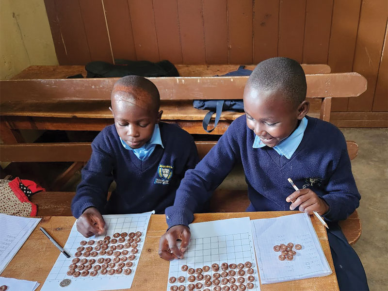 In the classroom, students benefit from Glaser’s creative teaching techniques such as activities to develop basic math skills and games to reinforce English language learning. 
