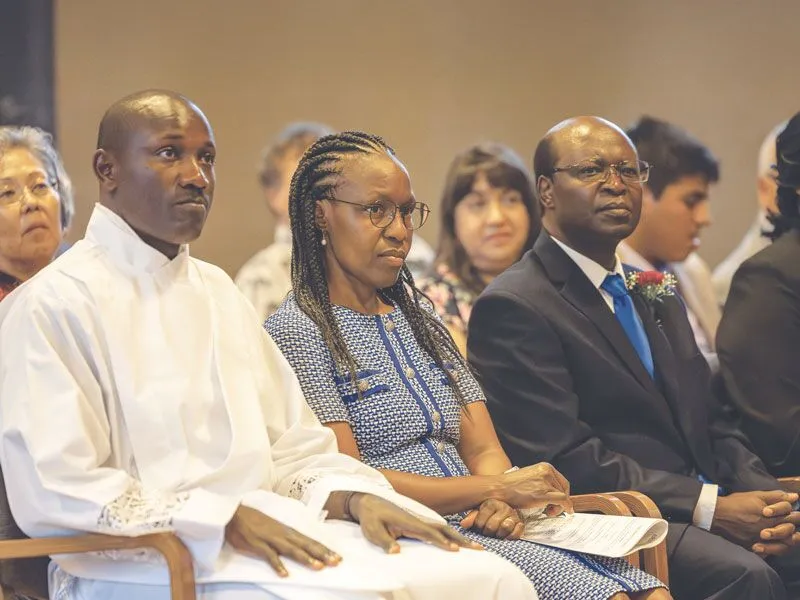 
Patrick Okok, of Kenya, asked Florence and Jospeter Mugambi to represent his parents, who were not given visas to attend the ordination in Ossining, New York. 
