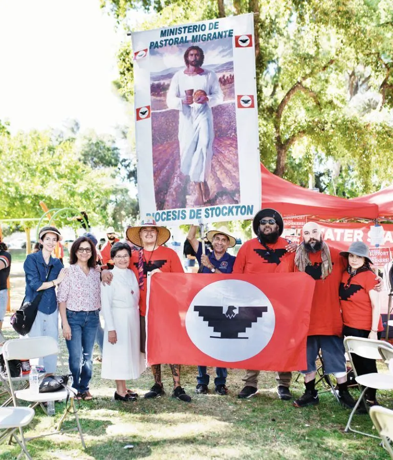 José López (holding diocesan banner) joins in a march organized by the United Farm Workers Union, walking for five days from Delano to Sacramento. 