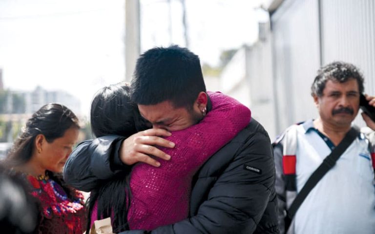 A migrant is welcomed by a family member at the migrant reception center in Guatemala City in January, after he and other migrants were deported from the U.S earlier this year. 