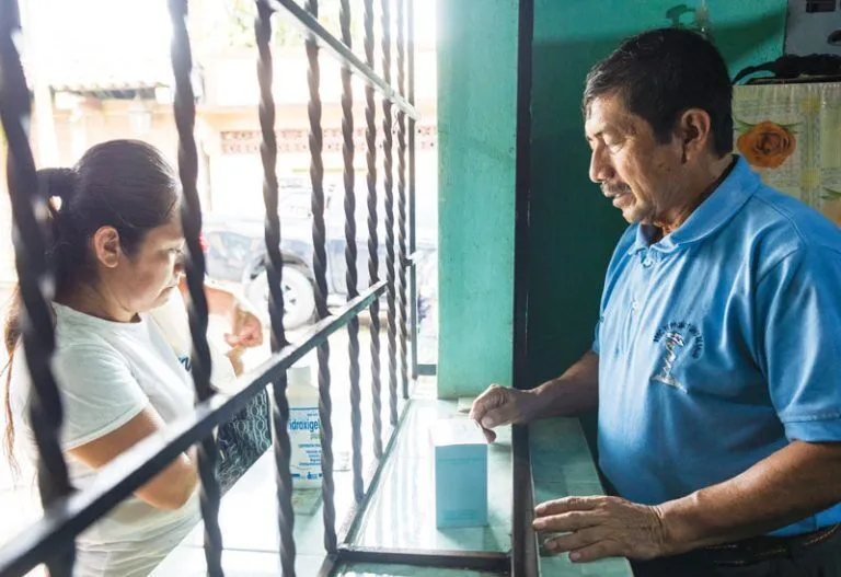 Carlos Romeo Orozco, a health promoter trained by the Maryknoll sisters, works at the program’s dispensary in the town of Catarina which provides medications at affordable prices. 