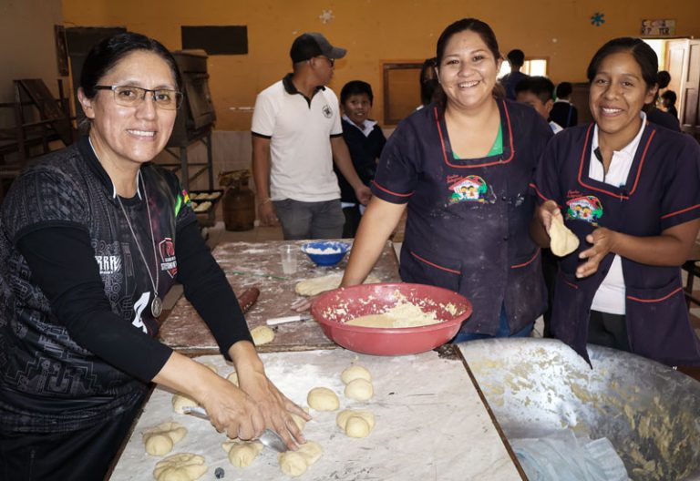 Sister Maribel Crispín Egúsquiza (left), shown with facilitators Milenka Luján and Beatriz Beltrán, comes back every year to help bake traditional Bolivian Day of the Dead bread for an annual Apoyo Escolar gathering. 