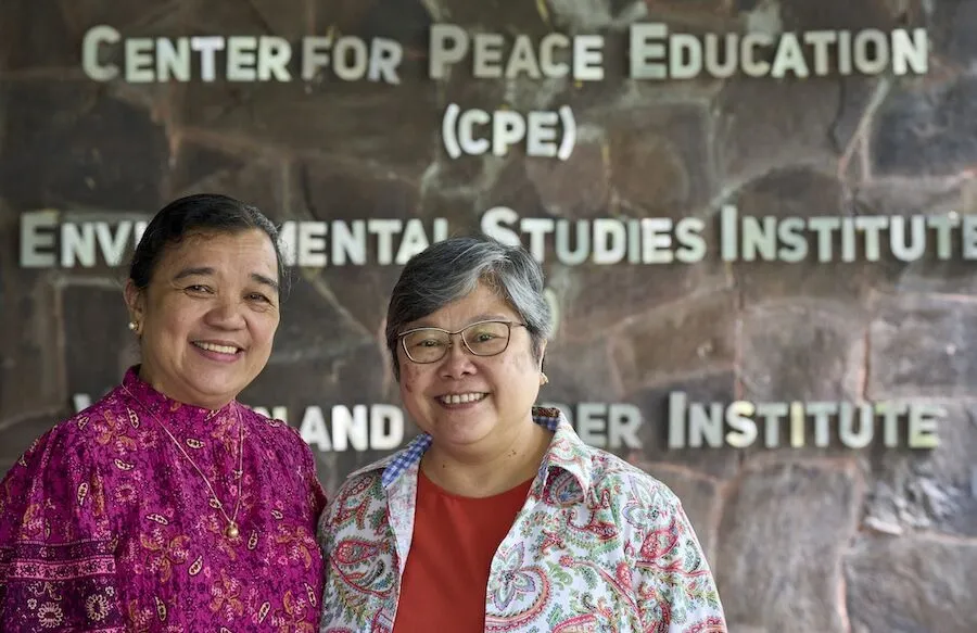 Maryknoll Sister Marvelous “Marvie” Misolas, right, works closely with Melinda Medina Lamorena, associate director of the Environmental Studies Institute at Miriam College, which was founded a century ago by the Maryknoll Sisters. 