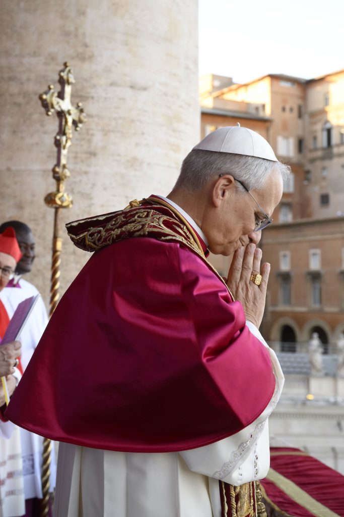 Pope Leo XIV, the former Cardinal Robert F. Prevost, prays before the crowds gathered in St. Peter’s Square at the Vatican after his election as pope May 8, 2025.
(CNS photo/Vatican Media)
