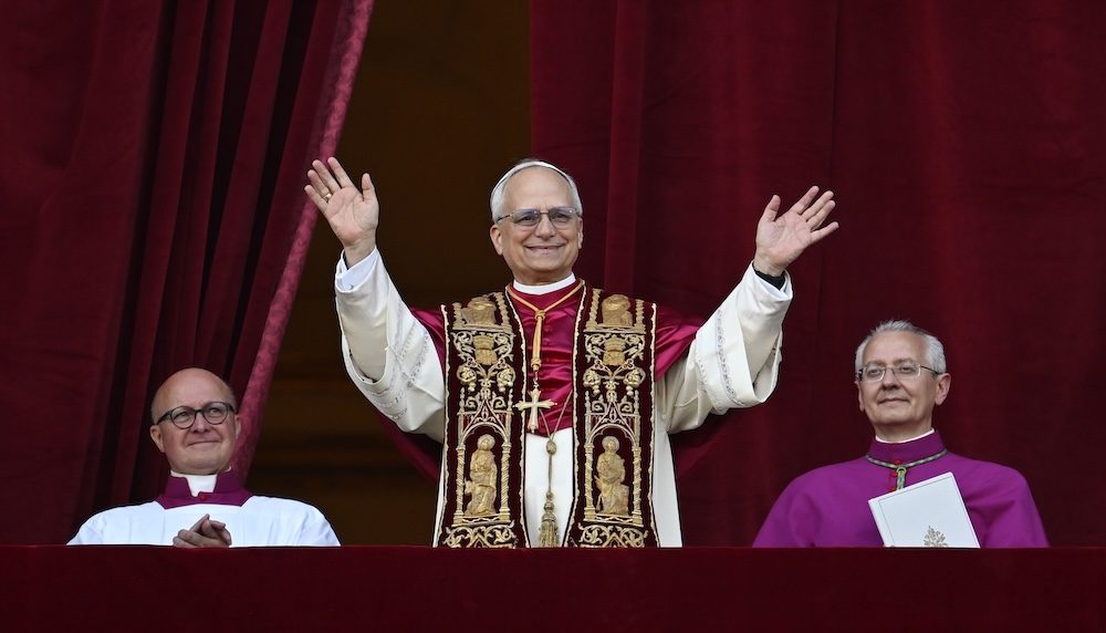 Pope Leo XIV, the former Cardinal Robert F. Prevost, waves to the crowds in St. Peter’s Square at the Vatican after his election as pope May 8, 2025. The new pope was born in Chicago. (CNS photo/Vatican Media)