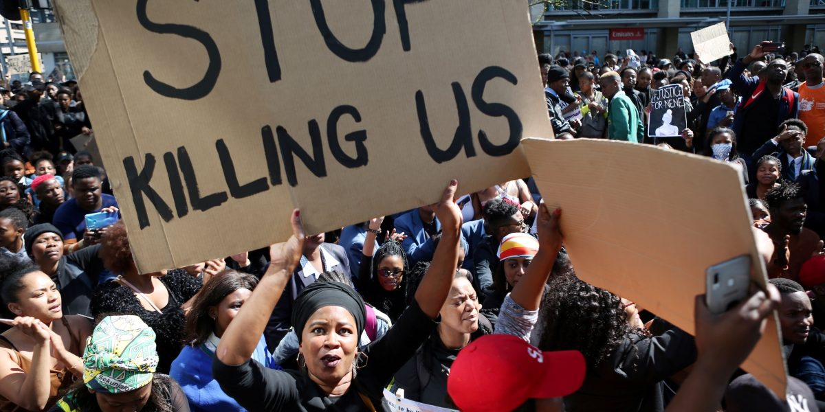 A woman holds a sign as demonstrators gather Sept. 4, 2019, at the World Economic Forum on Africa in Cape Town during a protest against gender-based violence. South African bishops called for action to end violence against women after a spate of killings and rapes sparked outrage in a country with one of the world’s highest murder rates. (CNS/Sumaya Hisham, Reuters)