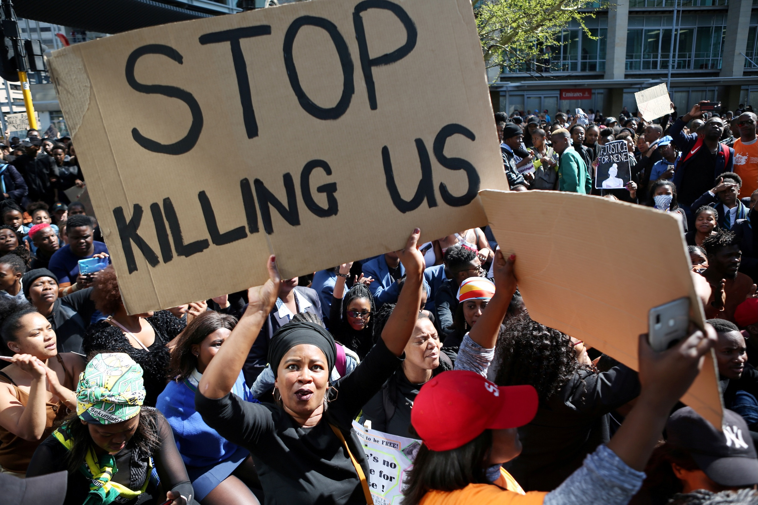 A woman holds a sign as demonstrators gather Sept. 4, 2019, at the World Economic Forum on Africa in Cape Town during a protest against gender-based violence. South African bishops called for action to end violence against women after a spate of killings and rapes sparked outrage in a country with one of the world’s highest murder rates. (CNS/Sumaya Hisham, Reuters)