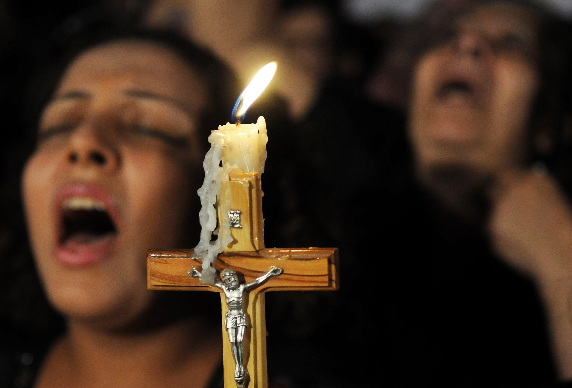 A crucifix is pictured in a file photo as Coptic Christians pray in Cairo. In the Coptic Orthodox Archdiocese of South Africa, three Egyptian Coptic monks were brutally murdered March 12, 2024, in their monastery in Cullinan, a small town about 18 miles east of the capital, Pretoria. (OSV News photo/stringer via Reuters)