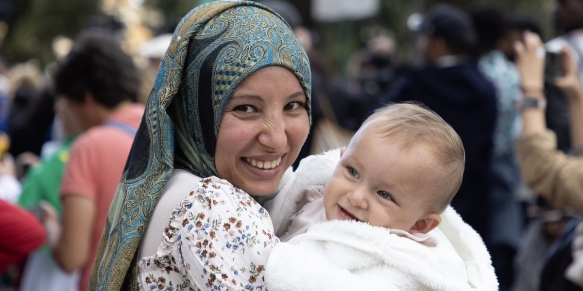 A mother and child attend the “Festival of Peoples,” a celebration of song, dance and testimonies during the Jubilee of Migrants and the Jubilee of the Missions, Oct. 5, 2025, at Castel Sant’Angelo in Rome. (CNS/Pablo Esparza)