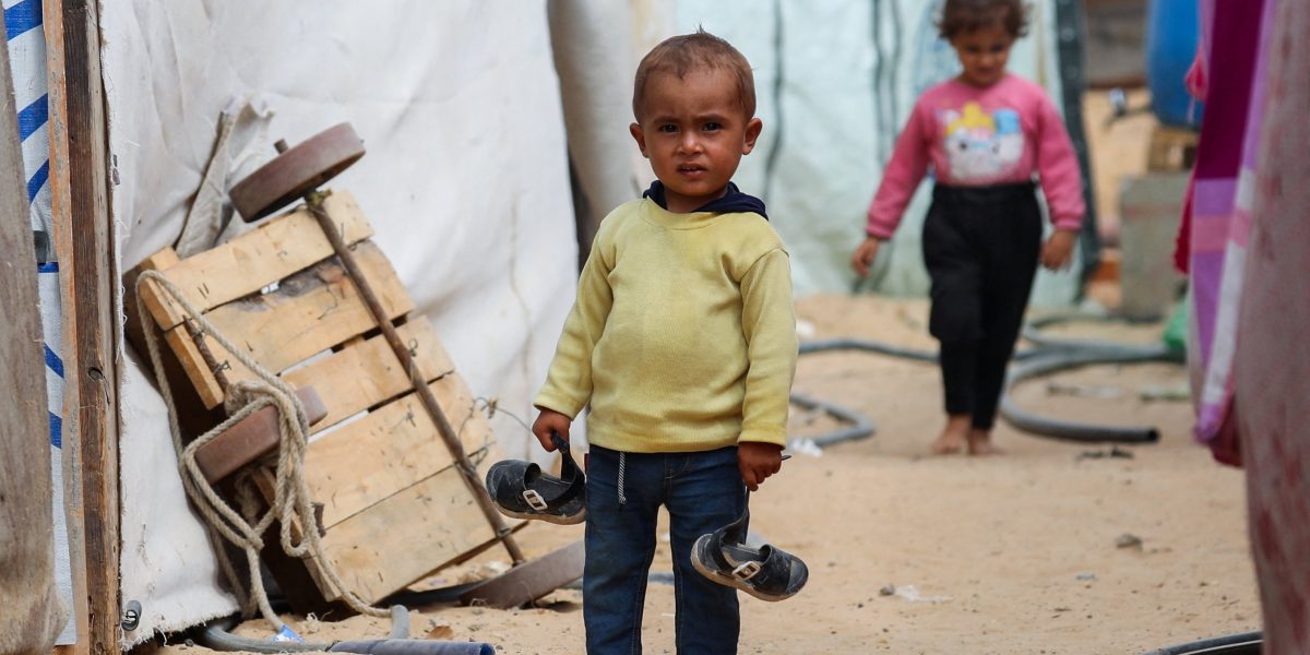 A Palestinian child stands between tents Oct. 6, 2025, where displaced Palestinians, who fled northern Gaza due to an Israeli military operation, shelter in the central Gaza Strip. (OSV News/Dawoud Abu Alkas, Reuters)
