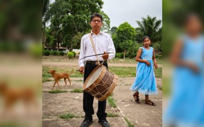 Don Saturnino Yabanure, a catechist at the Santísima Trinidad parish, plays music he learned from his ancestors and that he now passes on to younger generations in his community in the Bolivian Amazon. (Adam Mitchell/Bolivia)