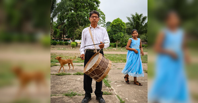 Don Saturnino Yabanure, a catechist at the Santísima Trinidad parish, plays music he learned from his ancestors and that he now passes on to younger generations in his community in the Bolivian Amazon. (Adam Mitchell/Bolivia)
