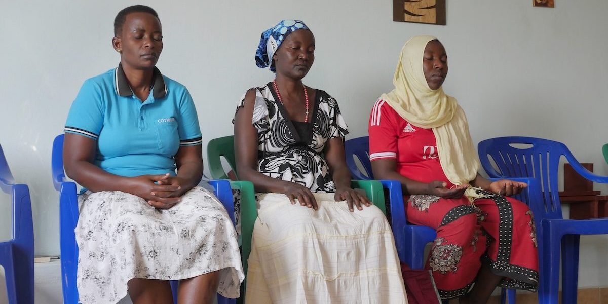 Neighbors join in prayer at the Good Shepherd Lake House of Prayer, on the shore of Lake Victoria, where Maryknoll Sister Janet Srebalus gives spiritual direction. (Sean Sprague/Tanzania)