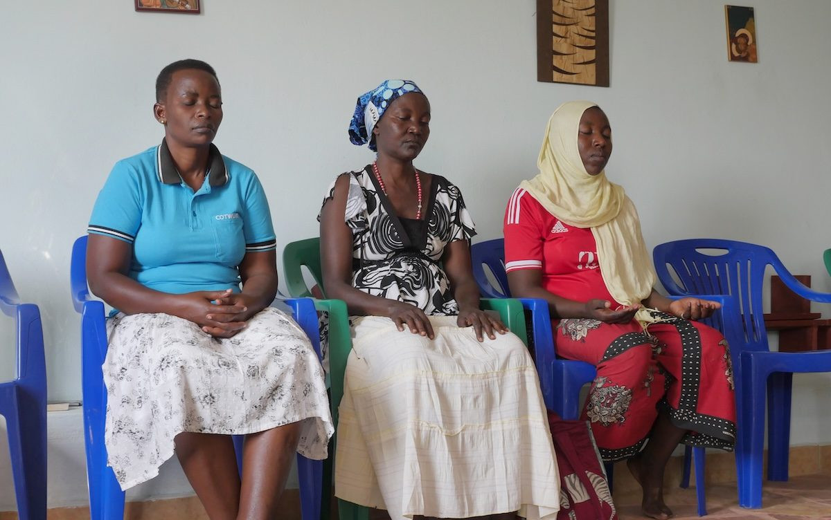 Neighbors join in prayer at the Good Shepherd Lake House of Prayer, on the shore of Lake Victoria, where Maryknoll Sister Janet Srebalus gives spiritual direction. (Sean Sprague/Tanzania)