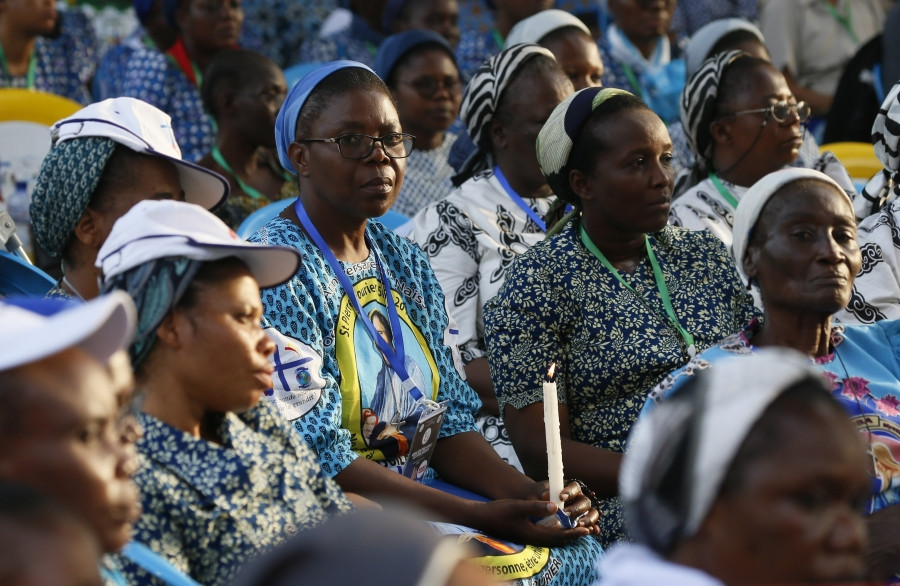 Women religious watch on a monitor outside the cathedral as Pope Francis leads a prayer meeting with priests, religious and seminarians Feb. 2, 2023, in Our Lady of the Congo Cathedral in Kinshasa, Congo. (CNS/Paul Haring)
