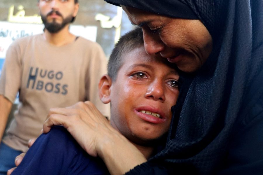 A boy cries during the Aug. 14, 2025, funeral of Palestinians killed in an Israeli airstrike while seeking aid in Gaza City, Gaza Strip, according to medics. (OSV News/Ebrahim Hajjaj, Reuters)