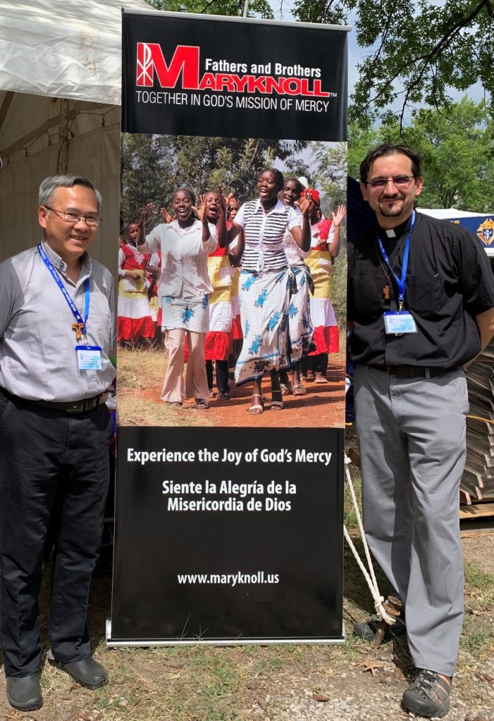 Maryknoll Fathers Hung Dinh and Rodrigo Ulloa pose with a banner. As director of vocations for Maryknoll Fathers and Brothers, Father Ulloa accompanies young men discerning a lifelong commitment to mission as priests or brothers. (OSV News/Courtesy of Rodrigo Ulloa)