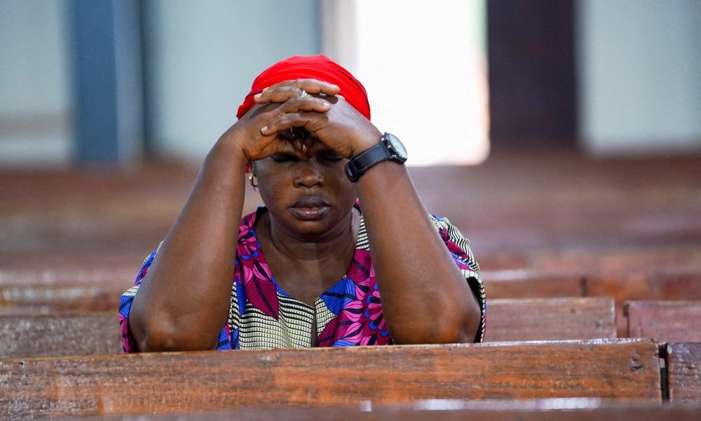 A woman prays during evening Mass at St. Michael Cathedral in Minna, Nigeria, Dec. 4, 2025. (OSV News/Marvellous Durowaiye, Reuters)