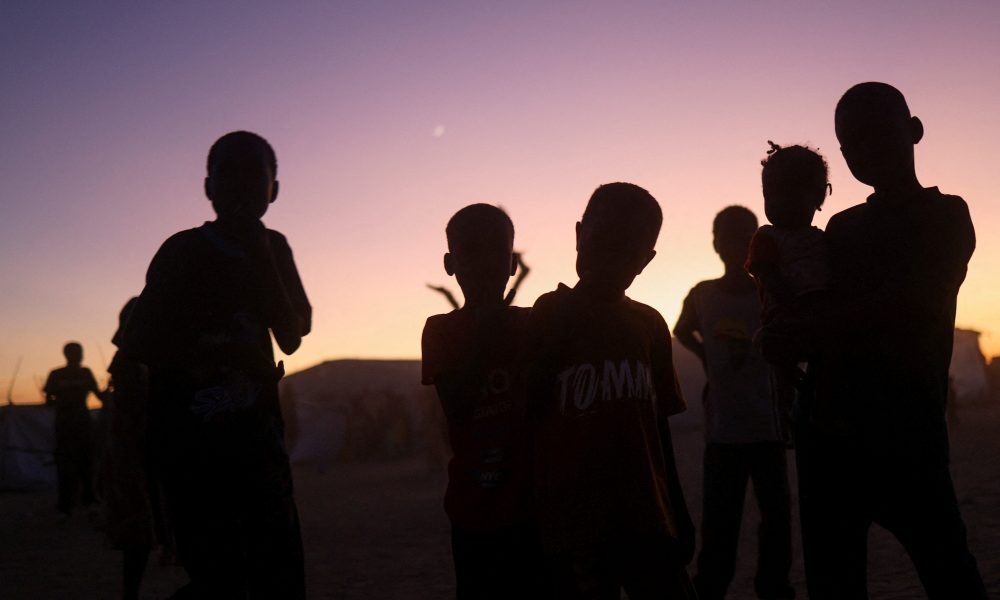 Sudanese refugee children from al-Fashir stand at sunset at the Tine transit refugee camp in eastern Chad Nov. 23, 2025, amid the ongoing conflict between the paramilitary Rapid Support Forces and the Sudanese army. Drones attacked a kindergarten and hospital in the town of Kalogi, Sudan, Dec. 4, killing more than 100 people, including children. (OSV News/Amr Abdallah Dalsh, Reuters)