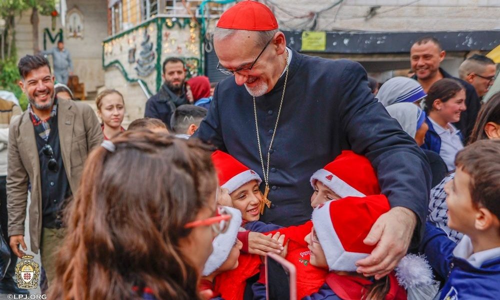 Cardinal Pierbattista Pizzaballa, Latin patriarch of Jerusalem, greets children as he visits the compound of Gaza City’s Holy Family Parish during his Christmas pastoral visit Dec. 19-21, 2025. He arrived prior to Christmas in a sign of closeness with a community that endured two years of war. (OSV News/Courtesy Latin Patriarchate of Jerusalem)