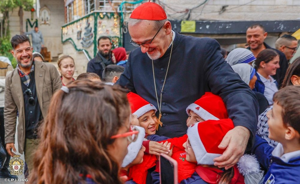 Cardinal Pierbattista Pizzaballa, Latin patriarch of Jerusalem, greets children as he visits the compound of Gaza City’s Holy Family Parish during his Christmas pastoral visit Dec. 19-21, 2025. He arrived prior to Christmas in a sign of closeness with a community that endured two years of war. (OSV News/Courtesy Latin Patriarchate of Jerusalem)