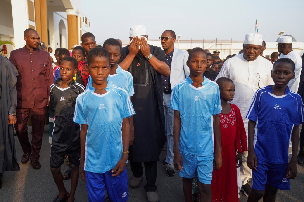 Schoolchildren from St. Mary’s Catholic School in Papiri, Nigeria, arrive at the Niger State Government House Dec. 8, 2025, after being freed from captivity following their abduction by gunmen Nov. 21. Church officials confirmed that the remaining 130 students were released on Dec. 21, ending a month-long ordeal that began when more than 300 pupils were abducted from the diocesan school in Niger State. (OSV News/Marvellous Durowaiye, Reuters)