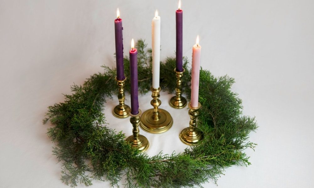Advent candles, available in the public domain via Unsplash.