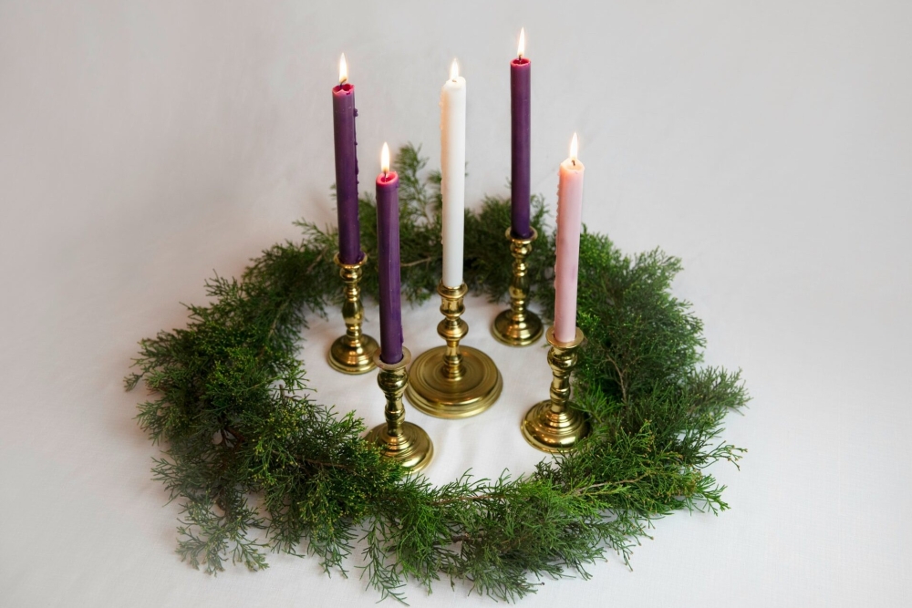 Advent candles, available in the public domain via Unsplash.