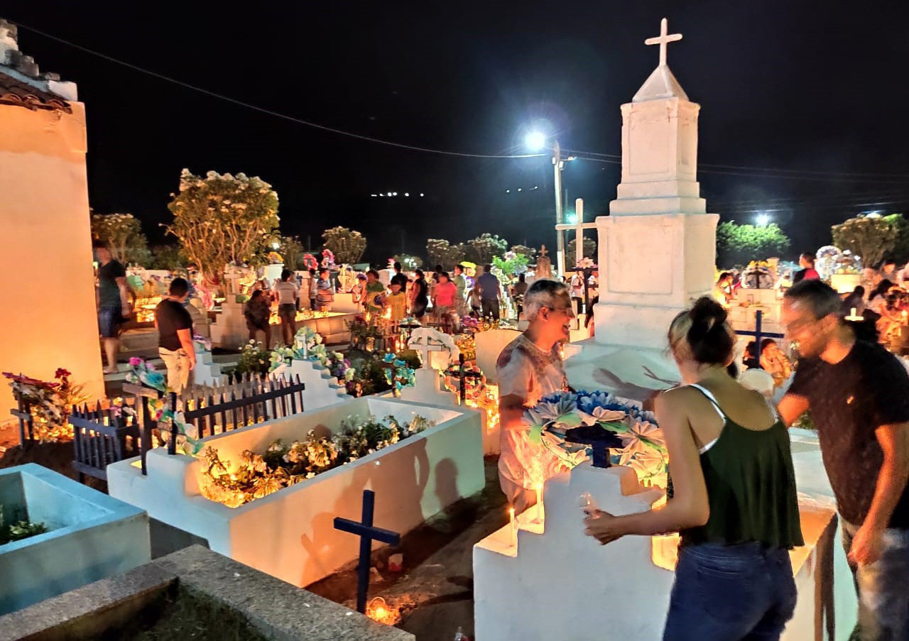 On All Souls Day (Nov. 2), families in Brazil visit a cemetery to clean and decorate the graves of their loved ones with fresh flowers, candles and personal mementos, holding vigils or even spending the night at the cemetery to pray, reflect and honor loved ones who have passed away. (Courtesy of Kathy Bond/Brazil)