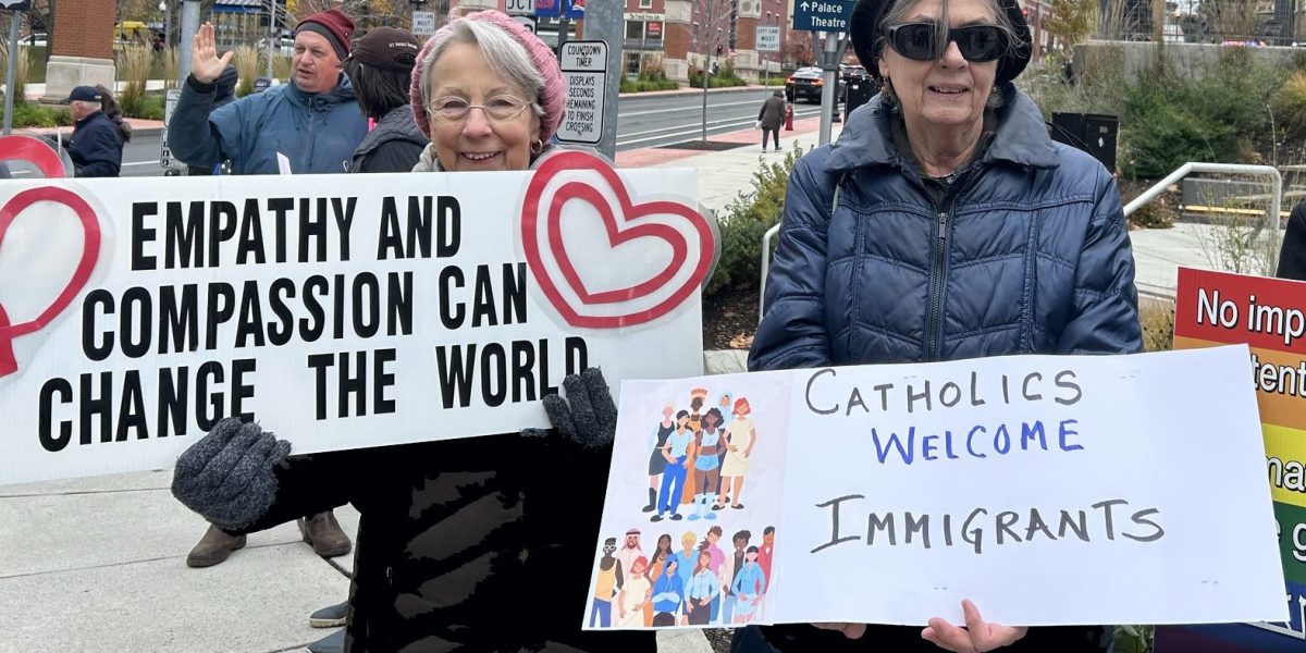 Maryknoll Affiliates in Albany, New York, hold signs at a prayer vigil on the feast day of St. Francis Xavier Cabrini, patron saint of immigrants, Nov. 14, 2025. Photo courtesy of the Maryknoll Affiliates and shared on their Facebook page.