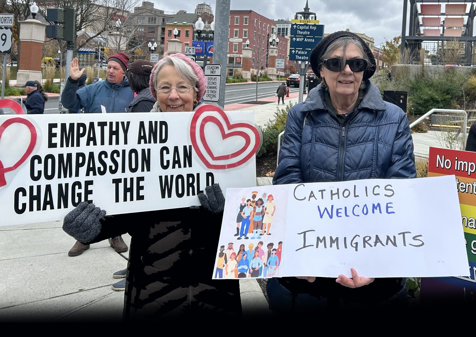 Maryknoll Affiliates in Albany, New York, hold signs at a prayer vigil on the feast day of St. Francis Xavier Cabrini, patron saint of immigrants, Nov. 14, 2025. Photo courtesy of the Maryknoll Affiliates and shared on their Facebook page.
