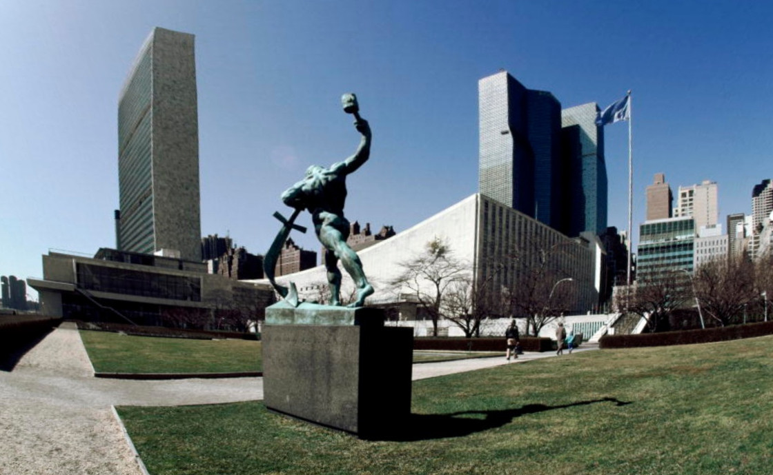 Photo of the bronze statue entitled “Let us Beat Swords into Ploughshares” in the United Nations garden in New York City, New York, by United Nations and licensed CC BY-NC-ND 2.0 (United Nations/Flickr/USA)