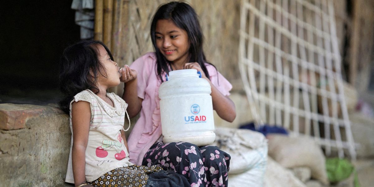 Rohingya children eat from a jar with the USAID logo at a refugee camp in Cox’s Bazar, Bangladesh, on Feb. 11, 2025. (OSV News/Ro Yassin Abdumonab/Reuters/Bangladesh)