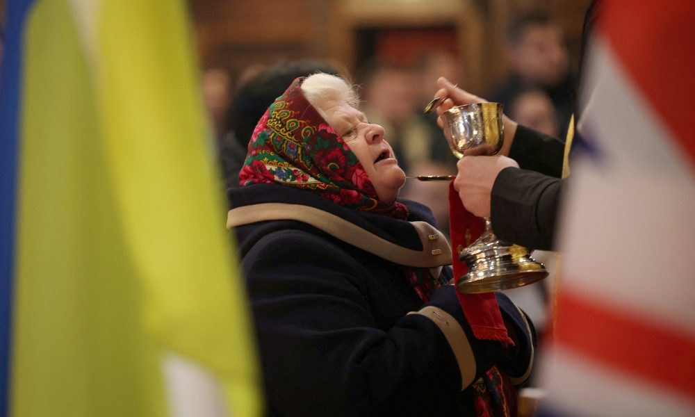A woman receives Communion during the Divine Liturgy at the Ukrainian Catholic Church in London Dec. 28, 2025, on the day Ukrainian President Volodymyr Zelenskyy meets U.S. President Donald Trump in Florida to work out a deal to end nearly four years of war since Russia’s full-scale invasion of Ukraine. The liturgy was celebrated on the feast of the Holy Family. (OSV News/Isabel Infantes, Reuters)
