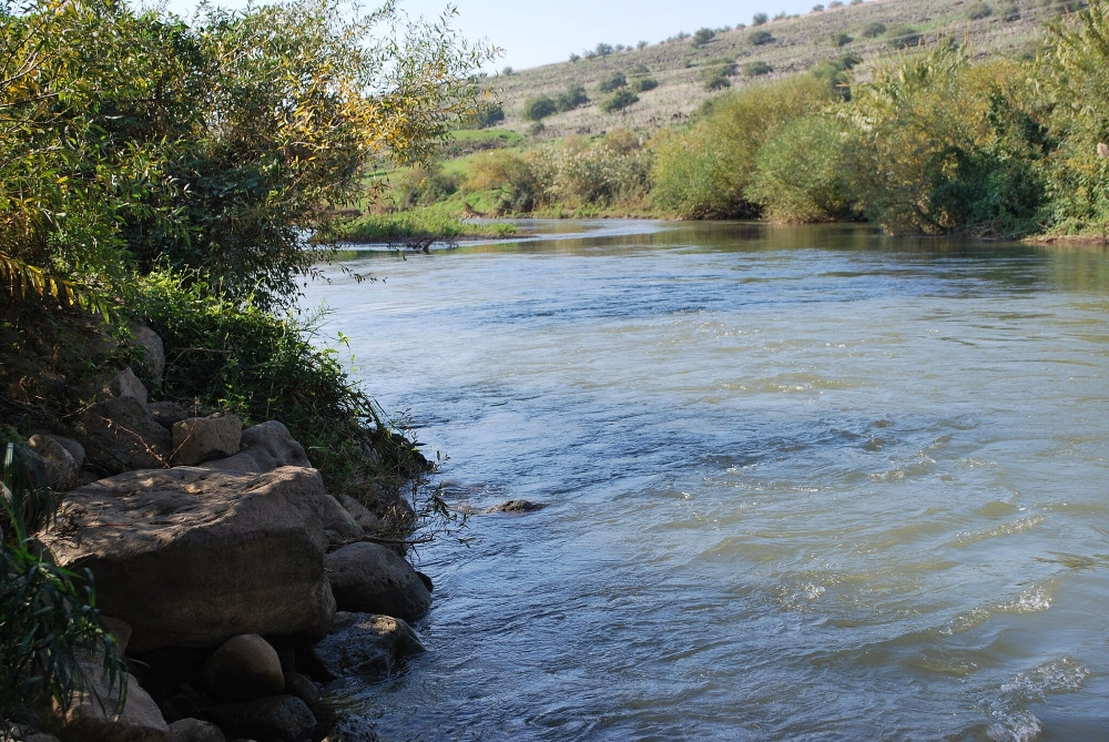 A photo shows the Jordan River, where Jesus was baptized by John the Baptist. (Bill Rice via Wikimedia commons, CC BY-SA 4.0).