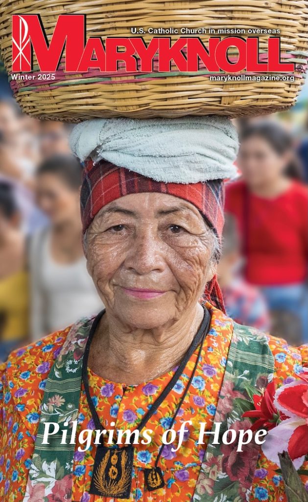 Winter 2025 cover of Maryknoll Magazine with a picture of a woman carrying a basket on her head