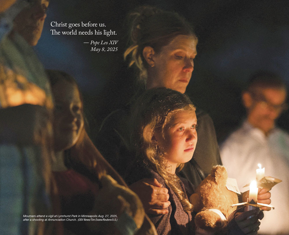 A young child in tears stands next to her mother holding a teddy bear and a candle