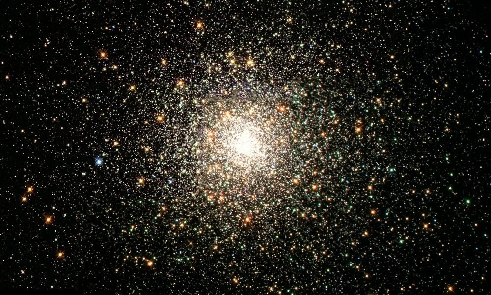 Bright Center Star Cluster, courtesy of NASA, available in the public domain via Unsplash. (NASA/Unsplash)
