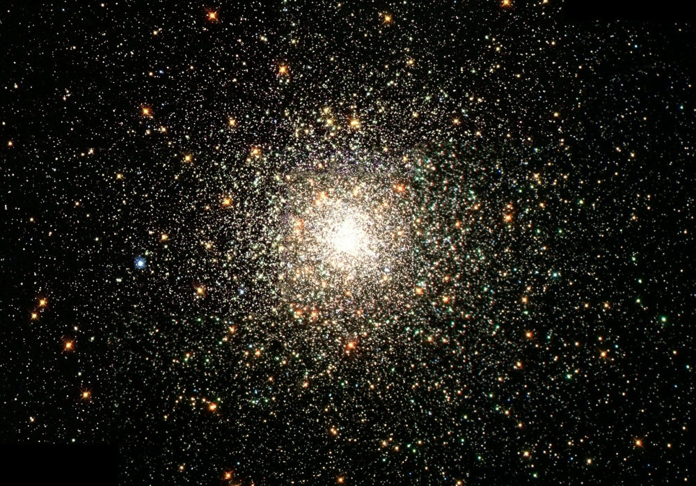 Bright Center Star Cluster, courtesy of NASA, available in the public domain via Unsplash. (NASA/Unsplash)