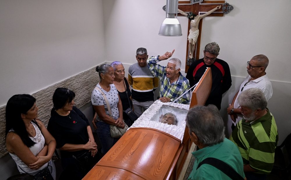 Jose Luis Gonzalez, brother of Rosa Elena Gonzalez, who died from injuries sustained during U.S. strikes in Venezuela, gives a speech as he and members of her family attend her funeral, on the outskirts of Caracas, Venezuela, Jan. 5, 2026. (OSV News/Gaby Oraa, Reuters)