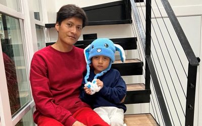 Liam Conejo Ramos, right, and his father Adrian Alexander Conejo Arias, who were detained by immigration officers in Minnesota and then taken to a detention center in Texas, sit on the stairs back at their home after a judge ordered their release, in Columbia Heights, Minnesota, in this picture obtained from social media Feb. 1, 2026. (OSV News/Joaquin Castro via BlueSky, via Reuters)