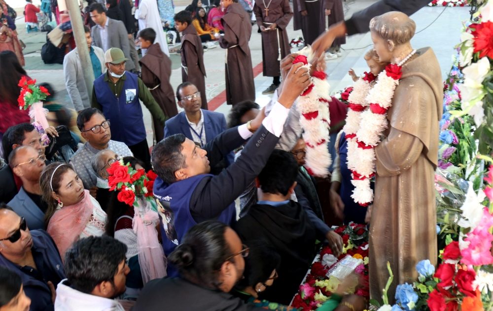 Pilgrims pray in front of the statue of St. Anthony during a pilgrimage in his name near Dhaka, Bangladesh, Feb. 6, 2026. Thousands of pilgrims have gathered at the shrine despite anxiety and fears of violence ahead of national elections in Muslim-majority Bangladesh, as they pray for peace in Bangladesh and the world. (OSV News/Stephan Uttom Rozario)