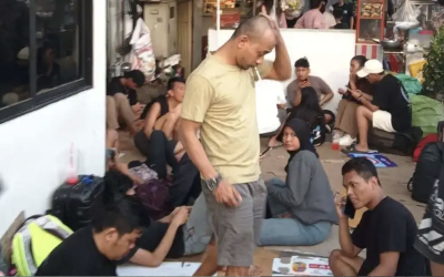 Desperate victims of scam center abuse wait for help outside the Indonesian embassy in Phnom Penh, Cambodia. (Terry Friel/Cambodia)