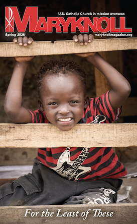The cover of the Maryknoll Magazine Spring 2026 issue with a young, smiling girl leaning on a fence.