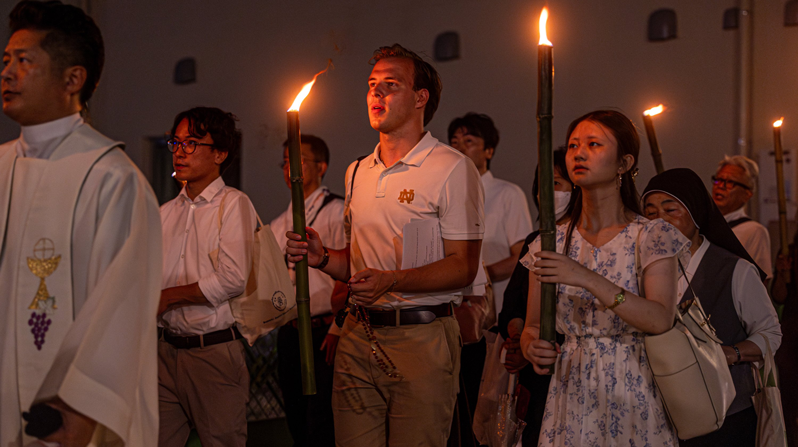 After a Peace Memorial Mass at Urakami Cathedral in Nagasaki, Japan, Aug. 9, 2025, people carry torches during a peace march to Hypocenter Park in commemoration of the 80th anniversary of the U.S. atomic bombing of Nagasaki. (OSV News photo/Mihoko Owada, Catholic Standard)