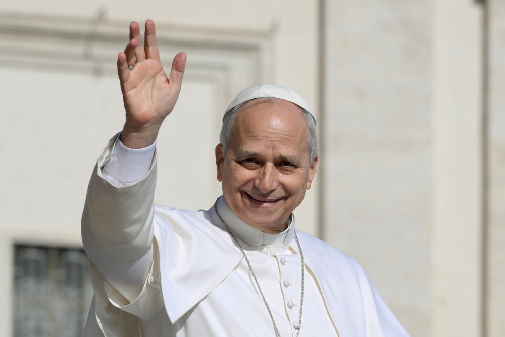 Pope Leo XIV greets the crowd before leading the general audience in St. Peter’s Square at the Vatican on February 18, 2026. (CNS/Vatican Media)
